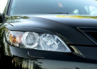 Система очистки оптики на автомобилях Mazda